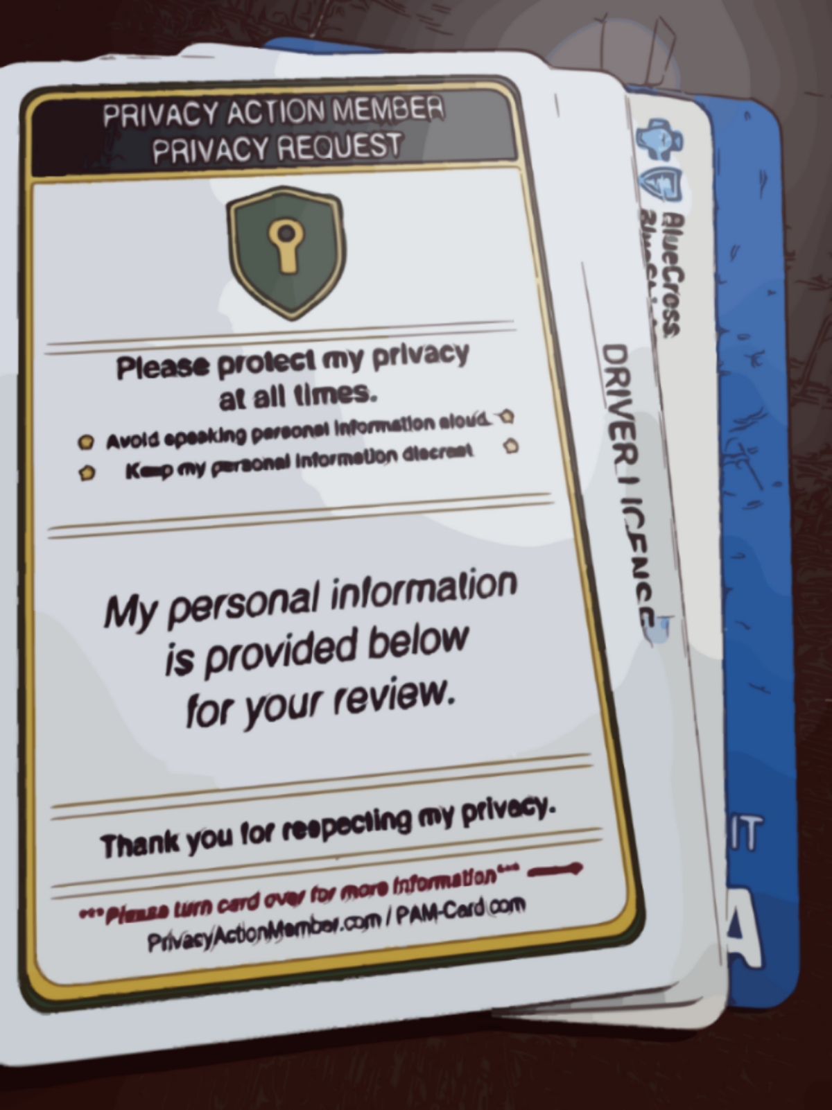 PAM-Card on top of ID, insurance and visa cards; covering their details from public view. Privacy requests on card.